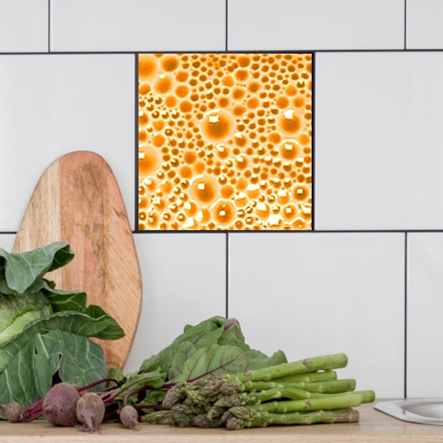 Azulejos decorativos con burbujas, mermelada naran (Orange marmalade bubble tile shown  in a kitchen.)