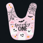 Babero Spooky One Pink Halloween Ghost<br><div class="desc">Celebrate a year of joy with this special 1st birthday baby bib. It's a perfect blend of comfort and cuteness. Let your little one indulge in their cake while staying mess-free in style. A memorable keepsake for this milestone event,  designed to make the day even more adorable and memorable.</div>