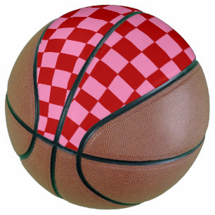 Balón De Baloncesto Rojo y rosado caliente bajo control