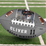 Balón De Fútbol Americano Foto Gray Happy Birthday Kids<br><div class="desc">Fútbol Gris Feliz Cumpleaños A Los Niños. Diseño de cumpleaños divertidos con texto de cumpleaños feliz, nombre personalizado, edad, año y foto. Las pelotas de fútbol están a cada lado de la foto y el fondo es gris oscuro. Personalizar la edad, nombre y añada tu foto favorita. Puedes personalizar o...</div>