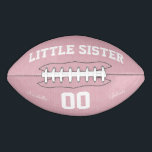 Balón De Fútbol Americano Little Sister<br><div class="desc">Little sister football on a pink textured background.
Fully customizable design makes a great keepsake.
Perfect for baby showers and first birthdays!</div>