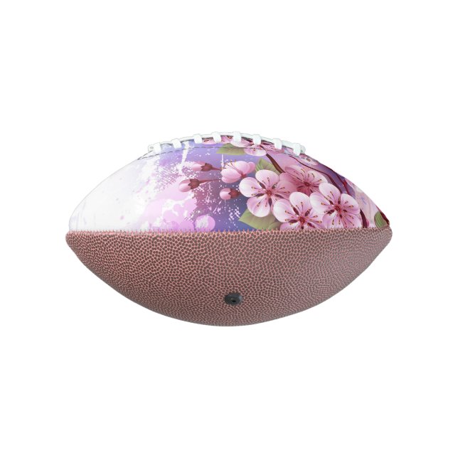 Balón De Fútbol Americano Sakura rosa sobre fondo de pintura (Girado 270)