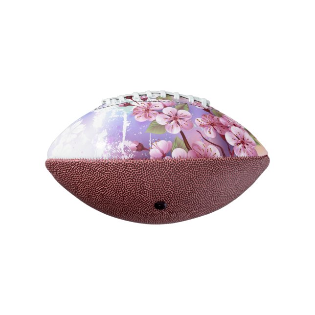 Balón De Fútbol Americano Sakura rosa sobre fondo de pintura (Girado 270)