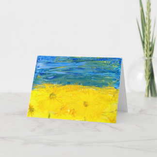 Bandera ucraniana con tarjeta de saludo en blanco