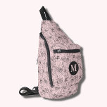 Bandolera Flores y rostros rosados monogramados<br><div class="desc">Este elegante bolso de honda presenta un diseño de rostros y flores dibujado a mano y su monograma inicial en la parte delantera. Tres compartimentos con cremallera pueden guardar fácilmente sus llaves, cartera, teléfono, cámara y mucho más. Lávelo como un cuerpo cruzado o sobre un hombro, y sujete la correa...</div>