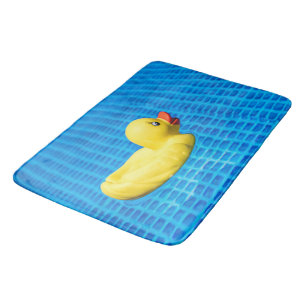 Bañera de pato de goma amarilla, alfombra doméstic
