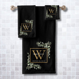 Baño de monograma de oro negro con vegetación en a