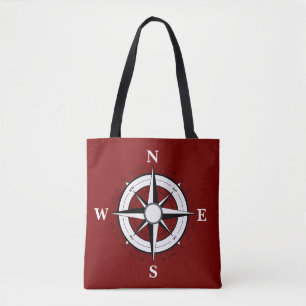 Barco negro náutico, brújula, bolsa roja