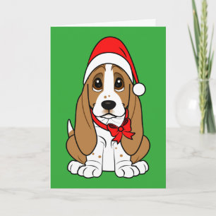 Basset Hound en el gorra de Santa en el navidad