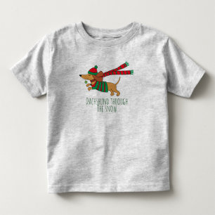 Bebé Dachshund a través de la camiseta del beisseta del