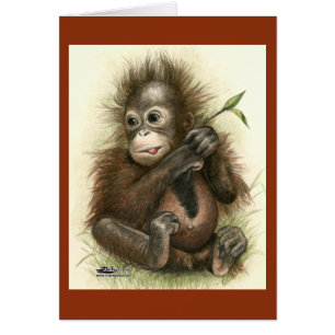 Bebé orangután con hojas