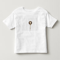 Pelota de golf y camiseta del oro