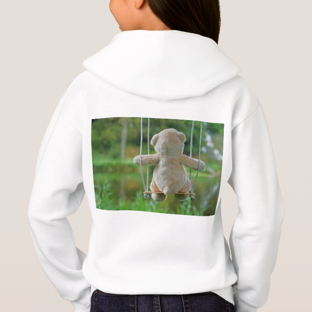 Beer op schommel vanaf de rug. (Reverso)