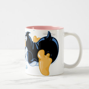 Besar la taza de café de los pingüinos
