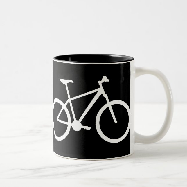 Bici de montaña blanca en la taza negra (Derecha)