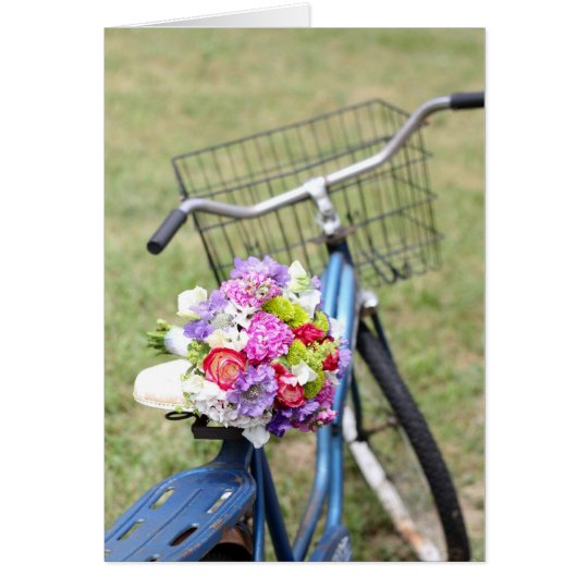 bici del vintage con la tarjeta de las flores
