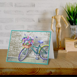 Bicicleta con tarjeta de nota de cesta de flores