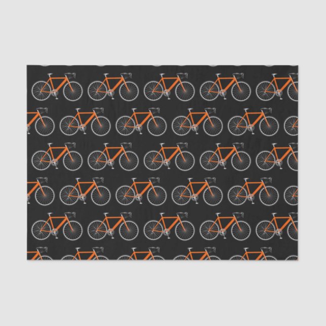 Bicicleta naranja sobre papel de tejidos negros (Anverso)