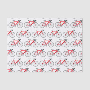 Bicicleta roja sobre papel de tejidos blancos