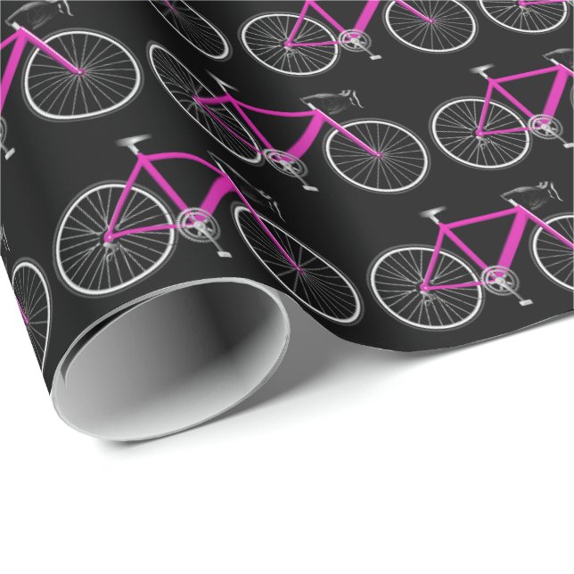 bicicleta rosa sobre papel de envoltura negro (Esquina del rollo)
