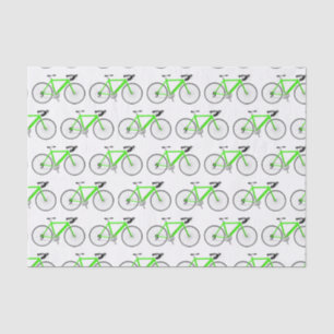 Bicicleta verde sobre papel tisular blanco