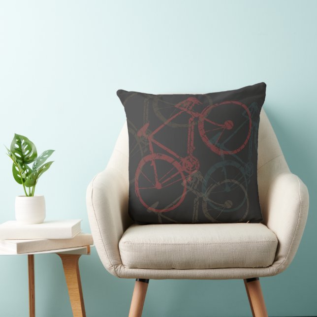 Bicicletas superpuestas en almohada negra (Silla)