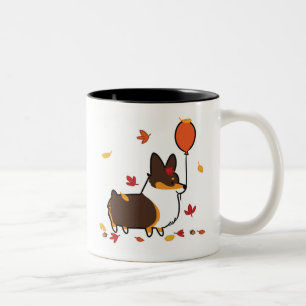 Bicolor Caída tricolora del Corgi en la taza el  