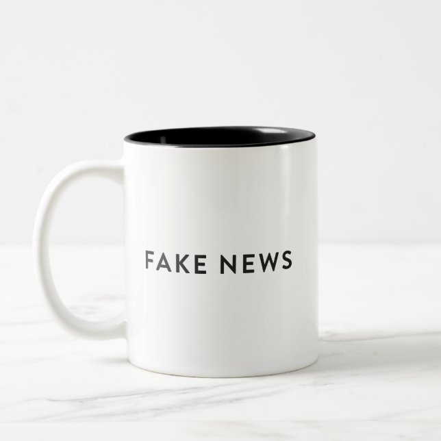 Bicolor #FakeNews falsos de la taza de las noticias (Izquierda)