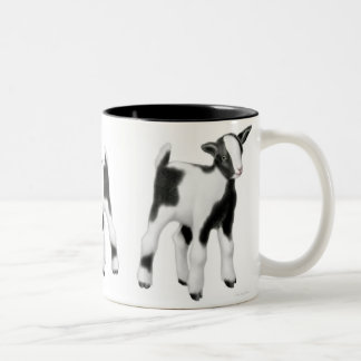 Bicolor La taza linda de la cabra del bebé