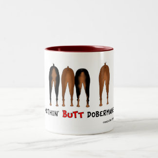 Bicolor Nada empalma la taza de los Dobermans