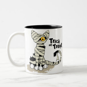 Bicolor Taza del truco o de la invitación del gato de la