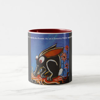 Bicolor taza negra del conejito