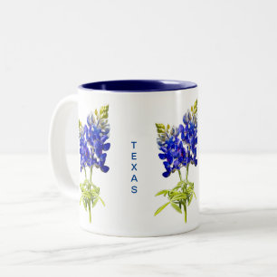 Bicolor Texas Bluebonnets sobre la taza blanca de café de 