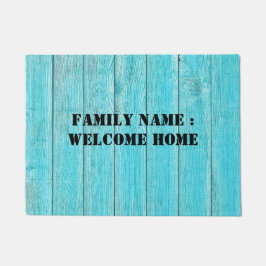 Bienvenido a casa fuera de la alfombra de la puert