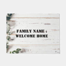 Bienvenido a casa fuera de la alfombra de la puert