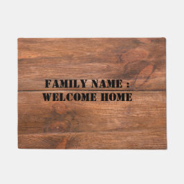 Bienvenido a casa fuera de la alfombra de la puert