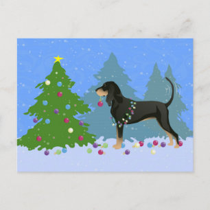 Black and Tan Coonhound Decoró el árbol de Navidad