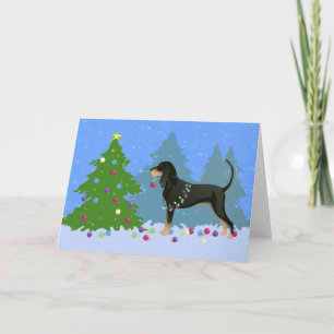 Black and Tan Coonhound Decoró el árbol de Navidad
