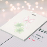 Bloc De Notas Shamrocks and bow<br><div class="desc">Pink bow with dangling shamrocks\,  customizable color background.
Customizable text.
5.5" x 6" Notepad - 40 pages - 40 pages</div>