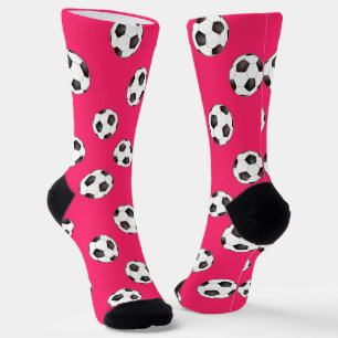 Bolas de fútbol en calcetines rosas