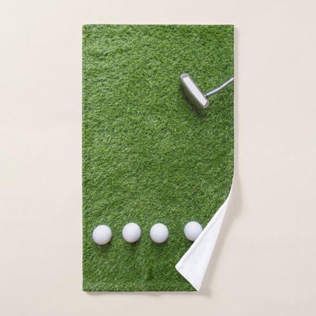Bolas de golf con Putter sobre césped verde (Toalla de mano)