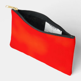 Bolsa brillante con cremallera roja sobre fondo bl
