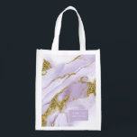 Bolsa De La Compra Lux Ink Lavender Abstract Wedding Party ID990<br><div class="desc">Este diseño a medida, con una tinta de alcohol abstracta en tonos de lavanda suave a violeta lila con acentos dorados brillantes, es perfecto para una boda romántica y elegante. El diseño de la bolsa de compras que se muestra aquí, proporciona una plantilla para añadir fácilmente el nombre, el nombre...</div>