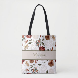 Bolsa de mano con flores monogramadas