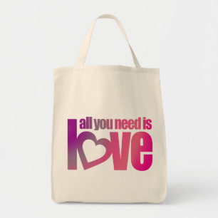 Bolsa de mano gráfica de color rosa y morado con l