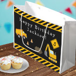 Bolsa De Regalo Grande Construction Happy Birthday with Name and Age Boy<br><div class="desc">Celebrate your little one's special day with this custom boy gift bag with an adorable construction theme. The gift bag has a dump truck and excavator working together at a road construction site. There are also orange traffic cones, a dirt pile, and yellow and black stripes. Add your Happy Birthday...</div>