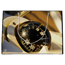 Bolsa De Regalo Grande Kompas helpt navigeren en koer behouden. 