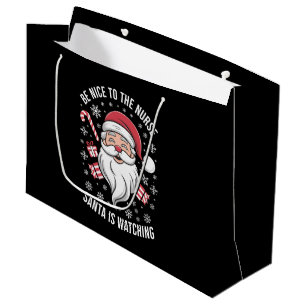 Bolsa De Regalo Grande Sé Amable Con La Enfermera Santa Está Observando N