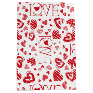 Bolsa de regalo mediana blanca con corazones rojos