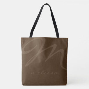 bolsa de tocador marrón con su nombre